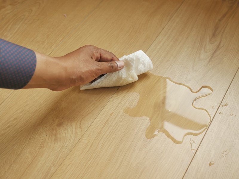 Wiping up a spill on waterproof laminate floor