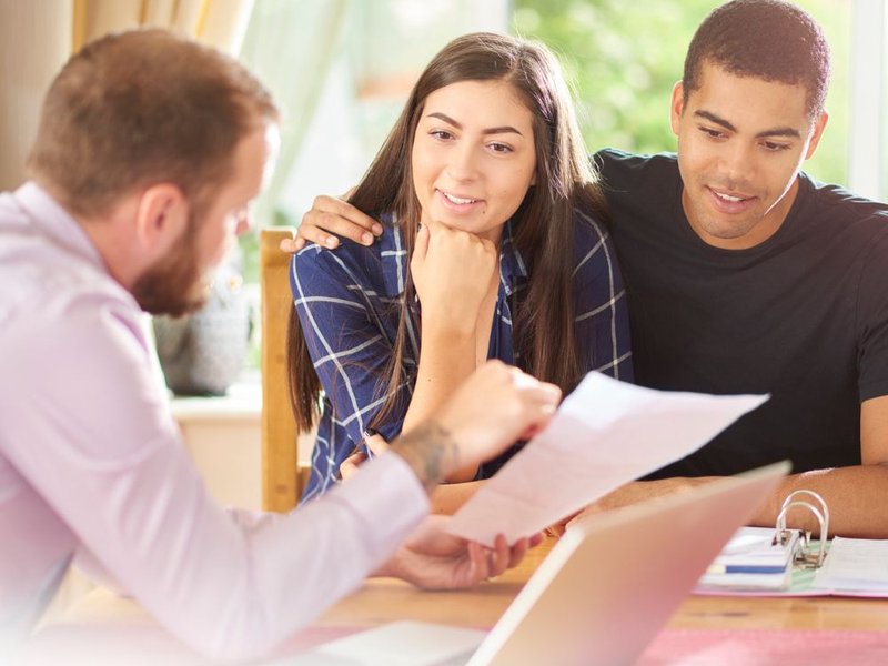 Couple exploring flooring options during consultation