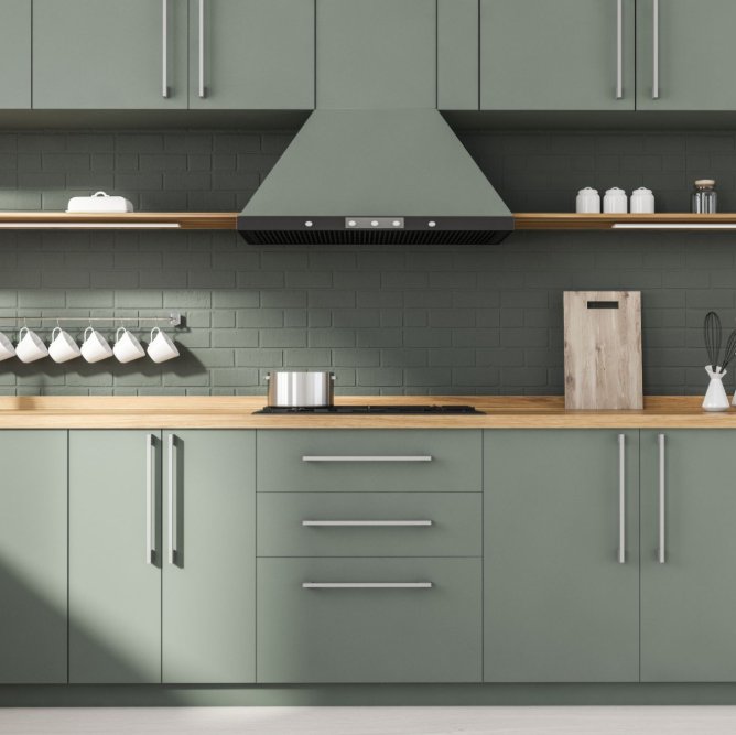 Sage green matte painted cabinets in a stylish kitchen