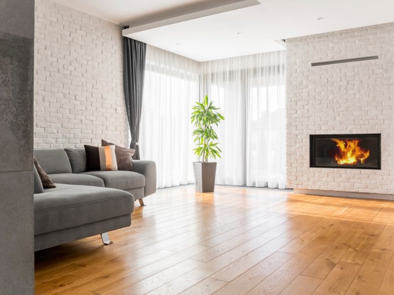 Heritage style apartment with white Subway tile walls and engineered wood flooring